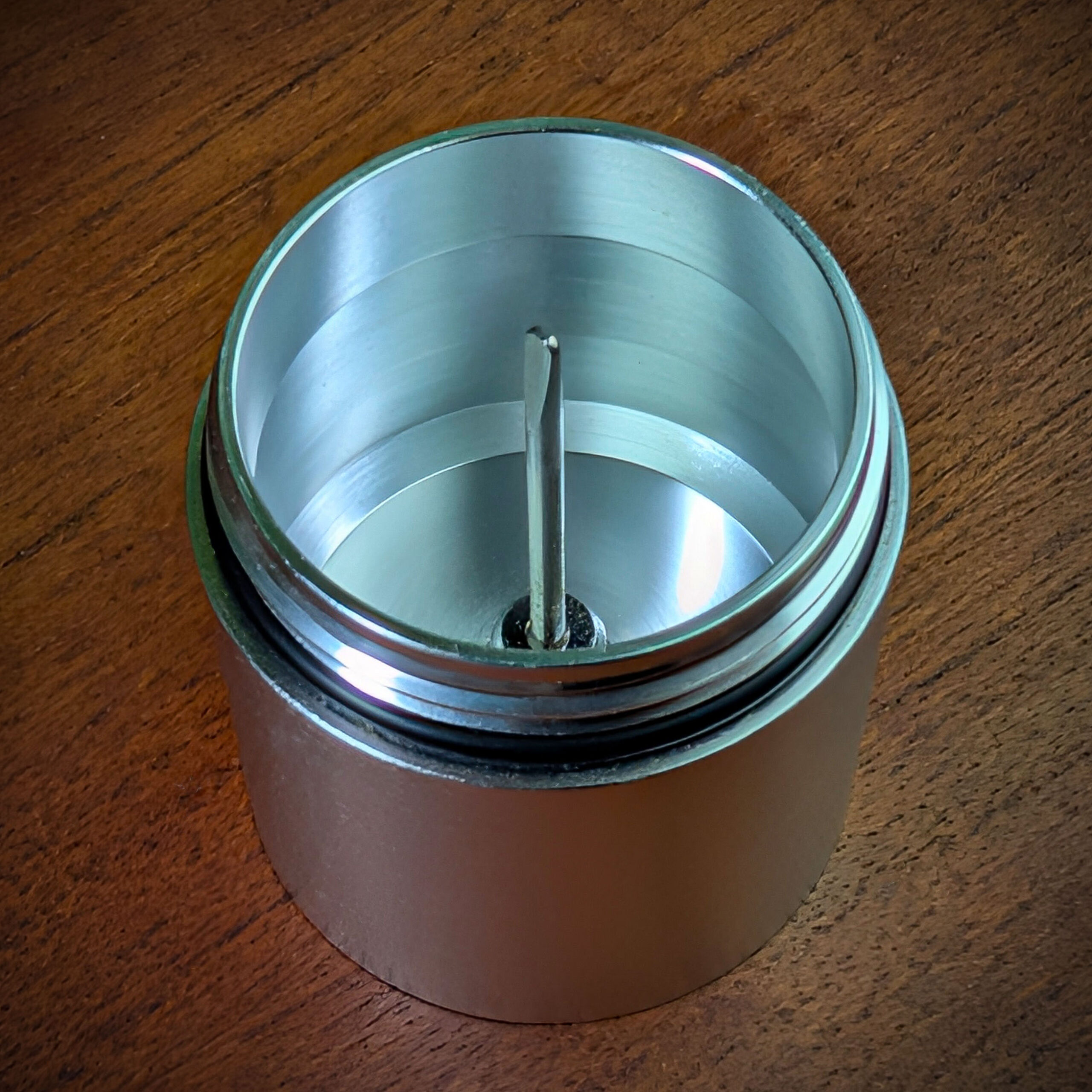 The debowler standing on a wooden table.