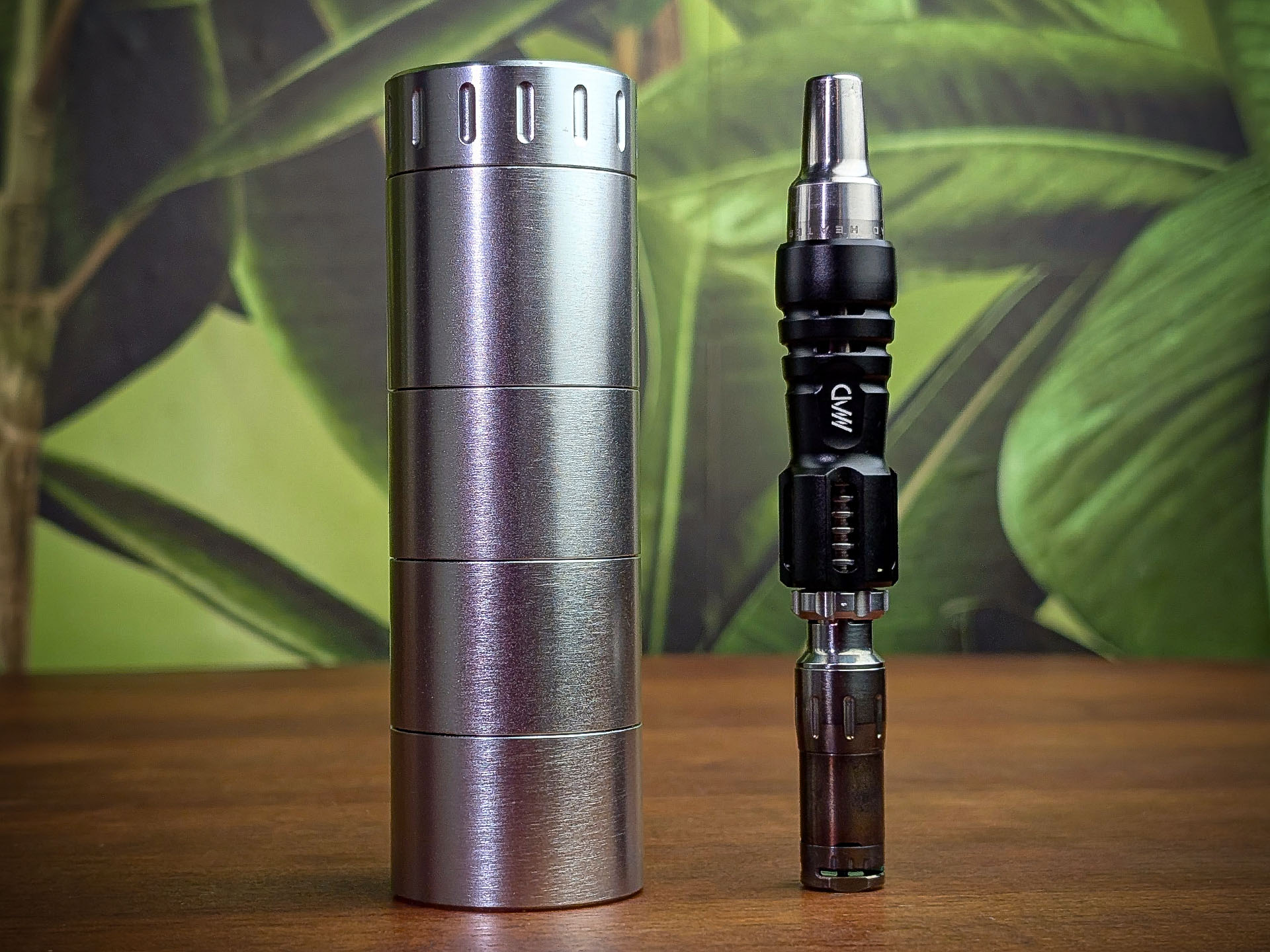 A Mad Heaters Reload 3 with an extra pot on a wooden table next to a Tempest 2.